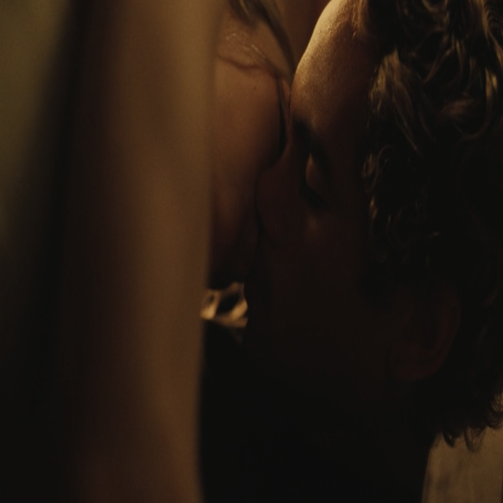 The two kissing in a scene