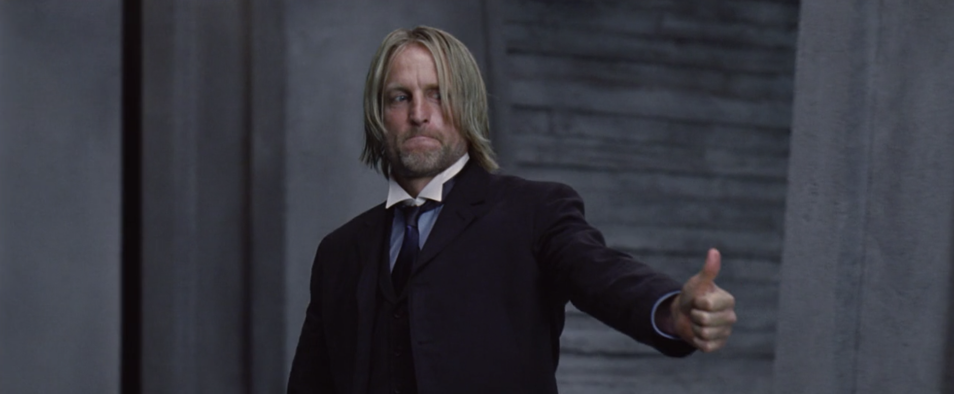 Haymitch giving a thumbs-up