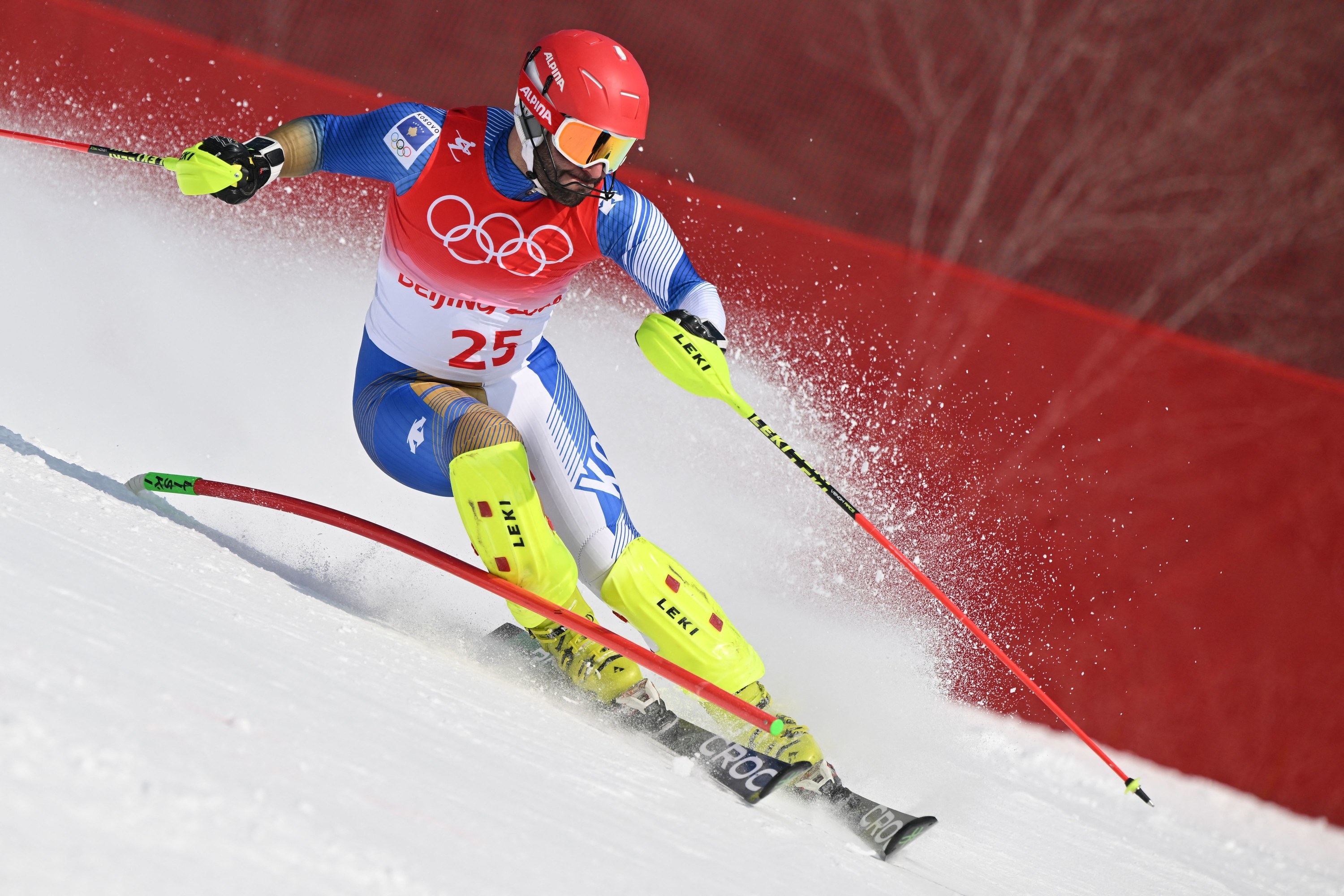 An athlete skiing down the mountain