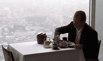 Bill Murray as Bob Harris in Lost in Translation eating dinner alone