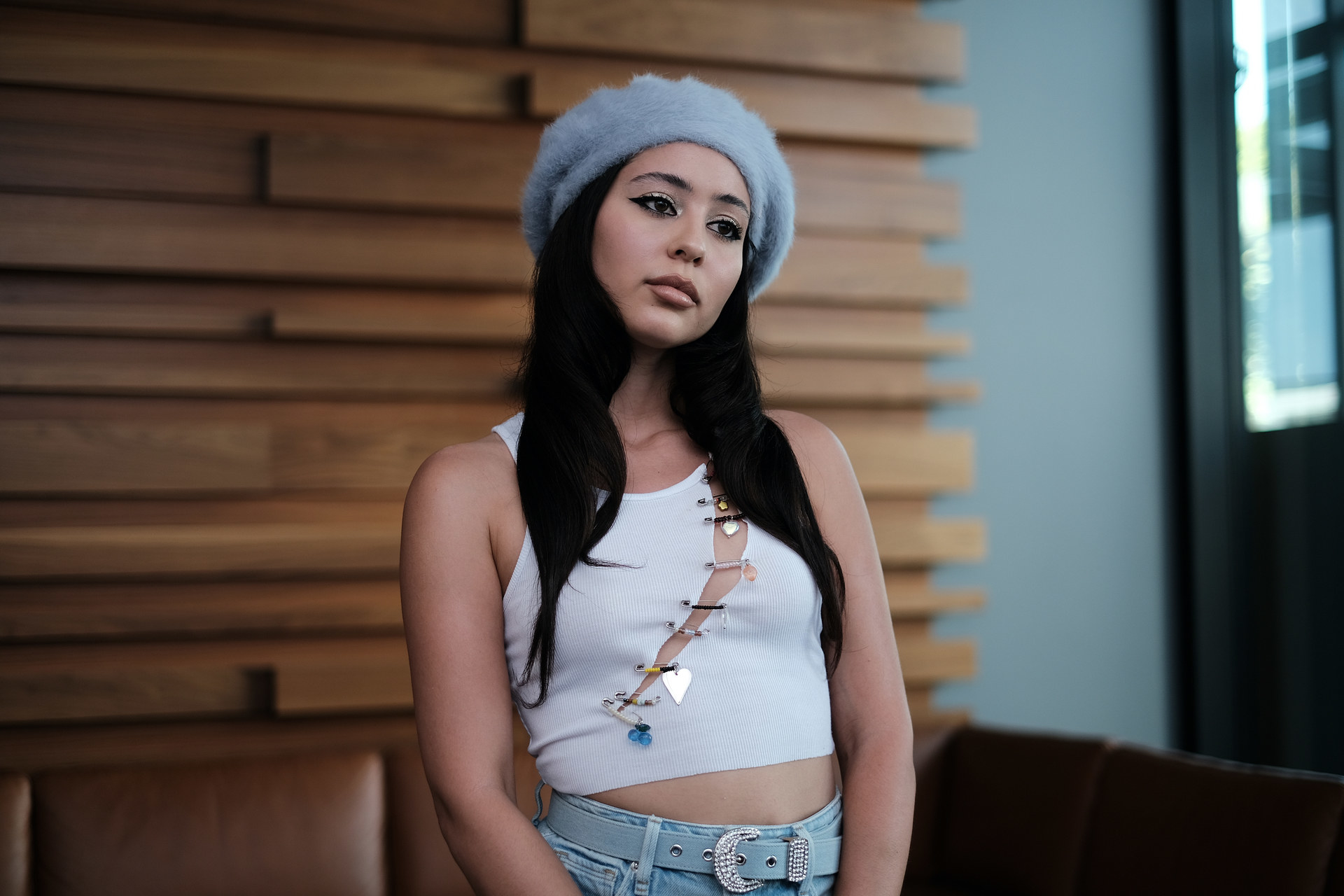 Maddy wears a blue beret and tank top with pin detailing in &quot;Euphoria&quot;
