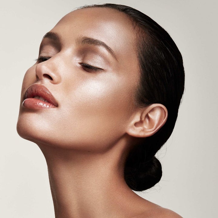 model wearing the highlighter on their face