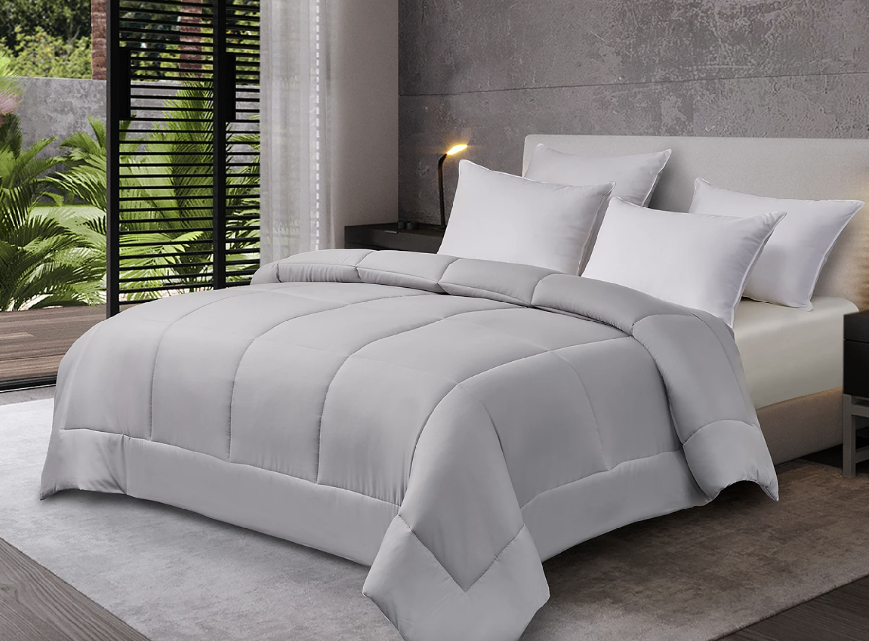 gray comforter on a bed