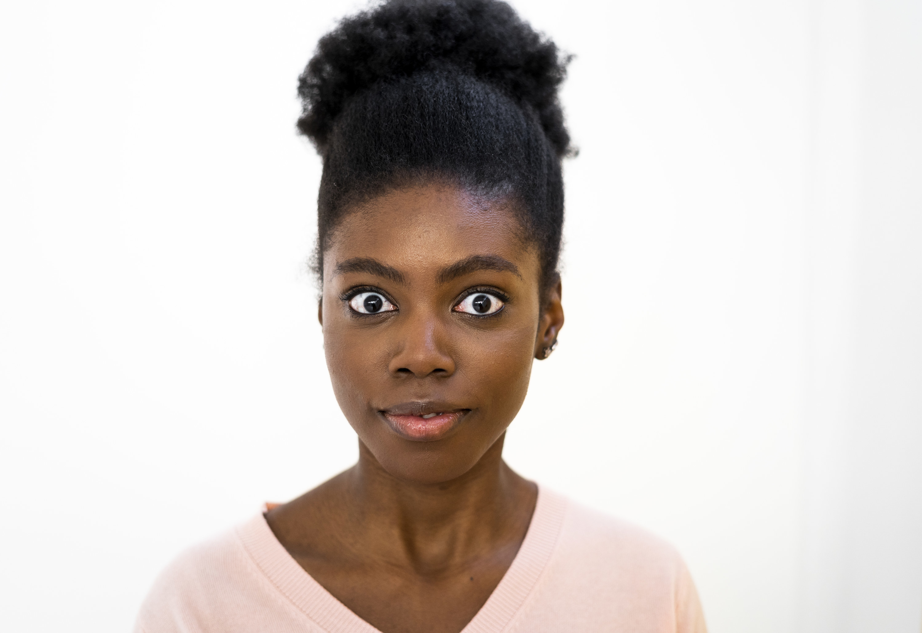 Woman starting at the camera looking shocked