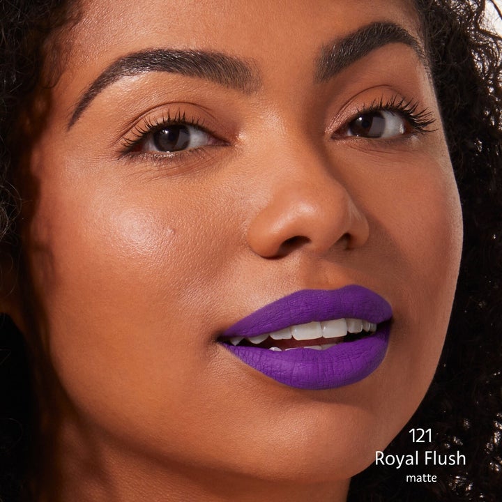 model wearing purple lipstick
