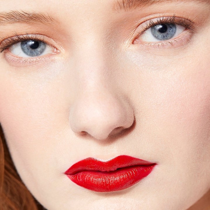 model wearing red lipstick