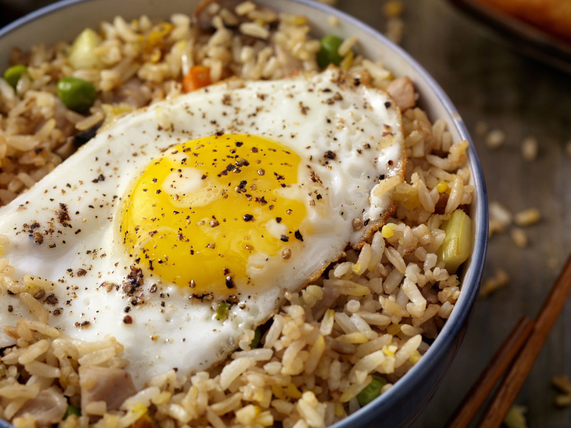 Fried rice with an egg on top.