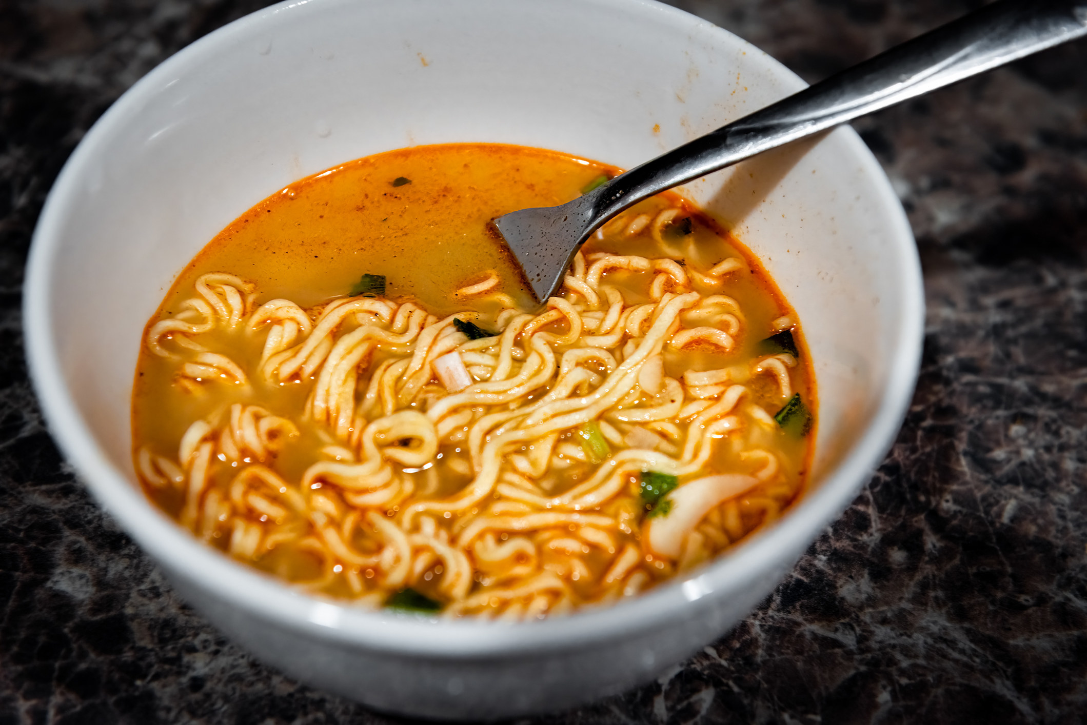 A bowl of spicy ramen noodles.
