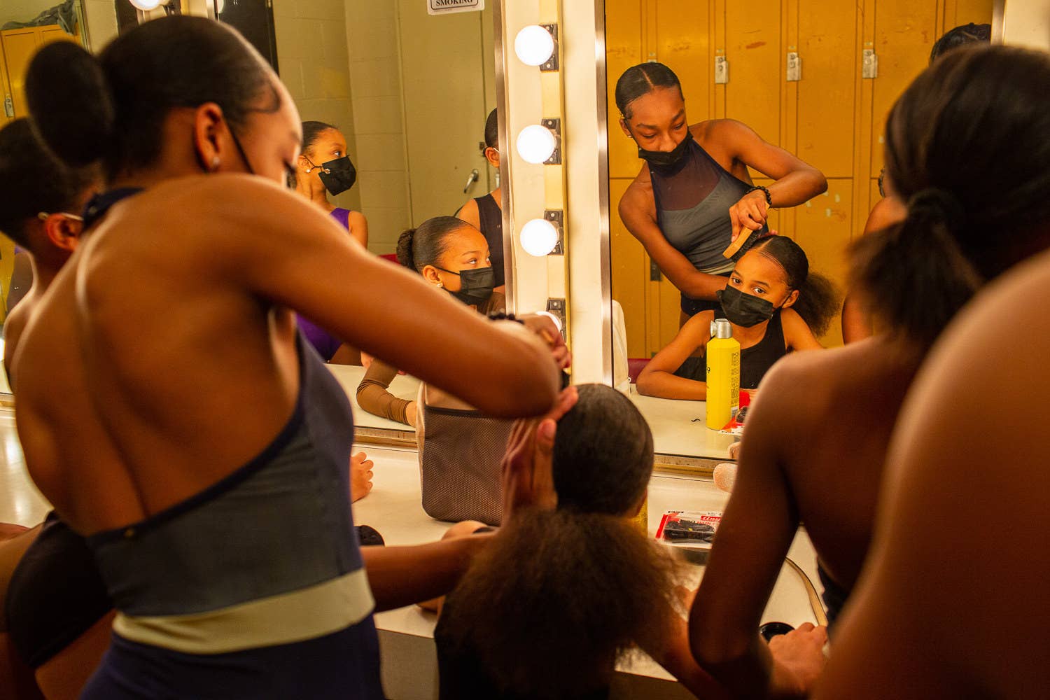 dancers getting ready in the mirror