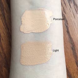reviewer's arm with two swatches of the tinted hydrator to compare shades and show its texture