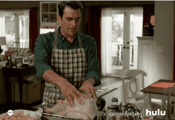 A man preparing a turkey.