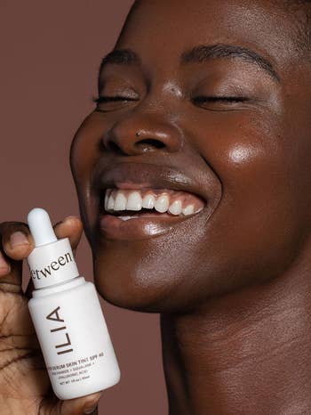 a different model holding up the bottle that matches their skin tone