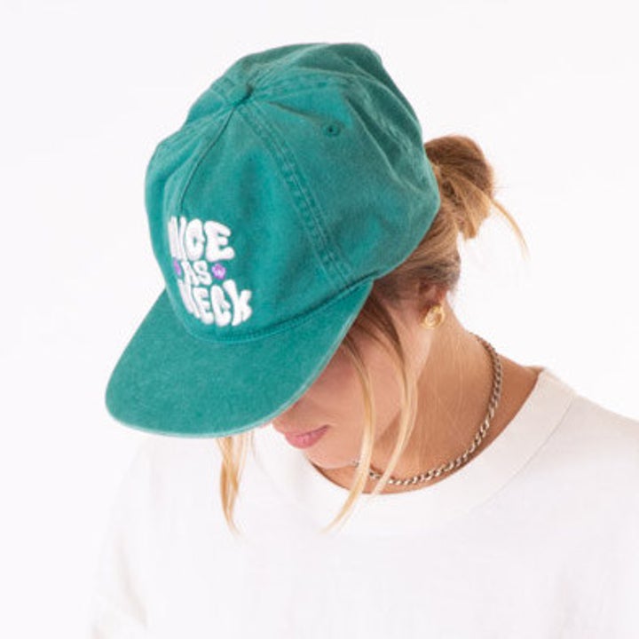 model wearing the green hat
