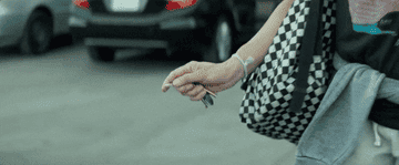 A woman keying someone&#x27;s car