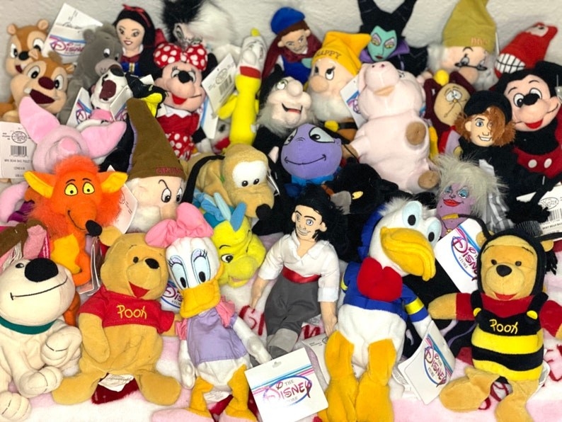 A large collection of Disney beanbag stuffed toys