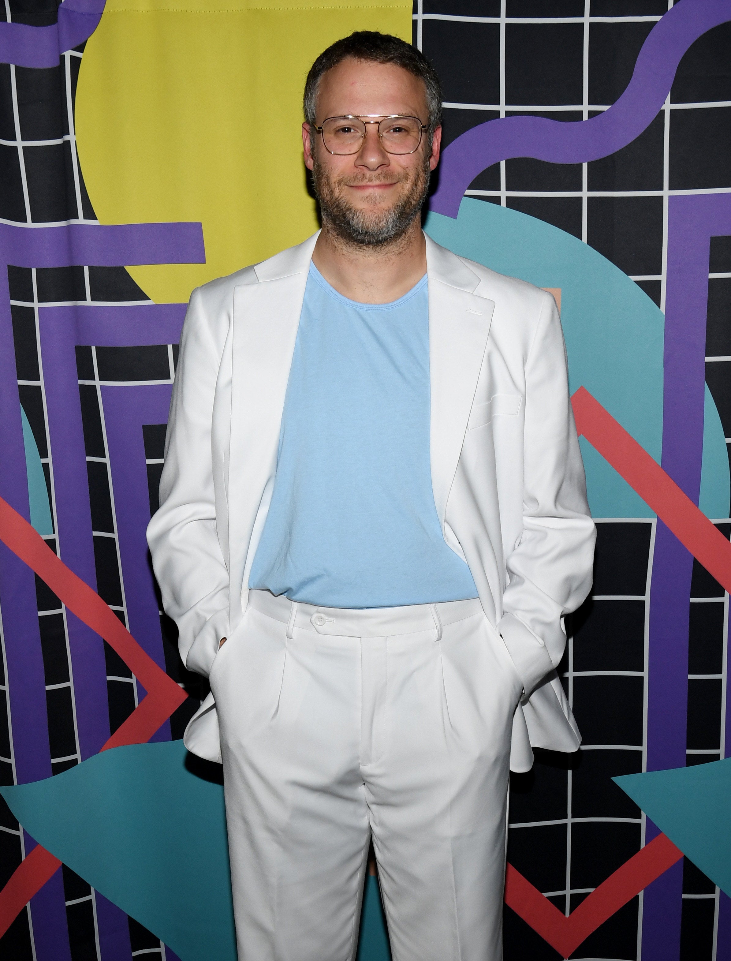 Rogen has his hands in his pockets