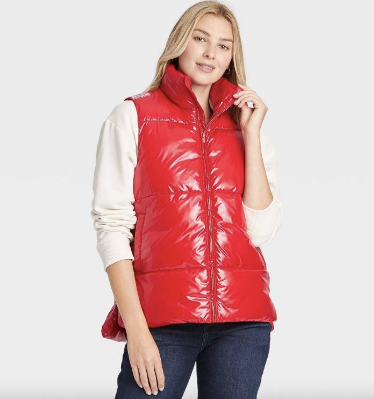 A person wearing a red puffer vest