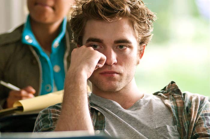 Robert Pattinson in class with head resting against hand