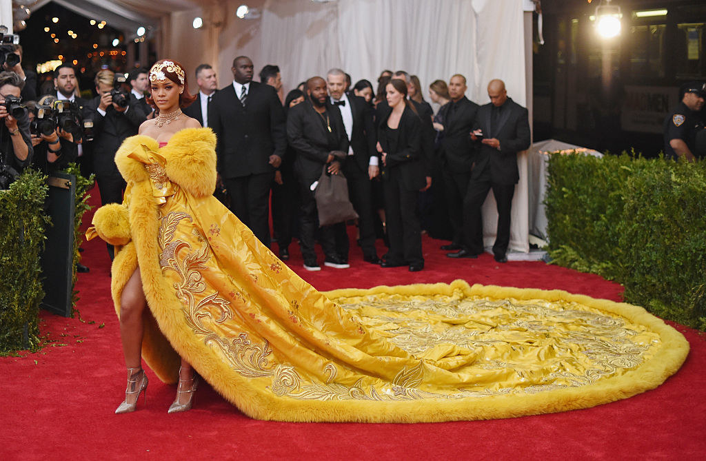 Rhianna at the MET Gala in a Guo Pei gown with a massive train