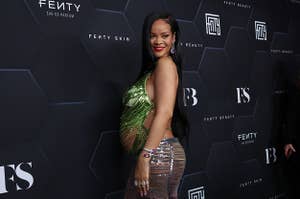 Rihanna poses on the red carpet with her baby bump