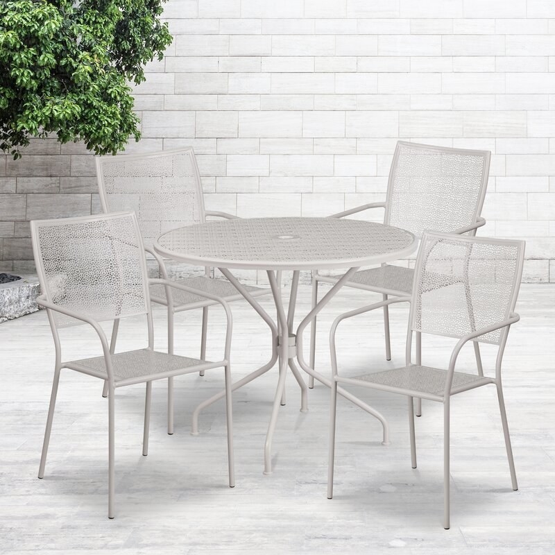 Gray set that includes a round table and four chairs