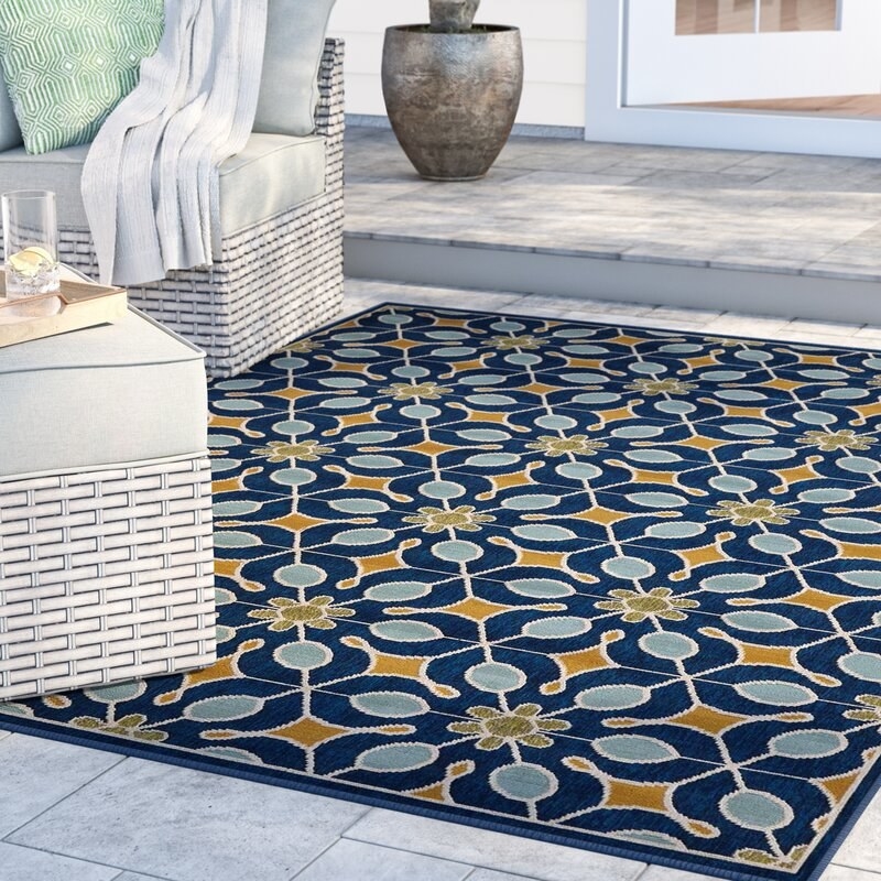 Rug out on a patio with outdoor furniture