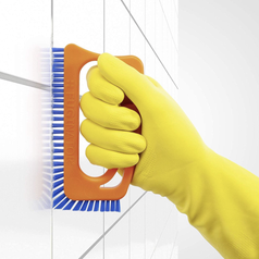 model using scrubber brush on tile grout