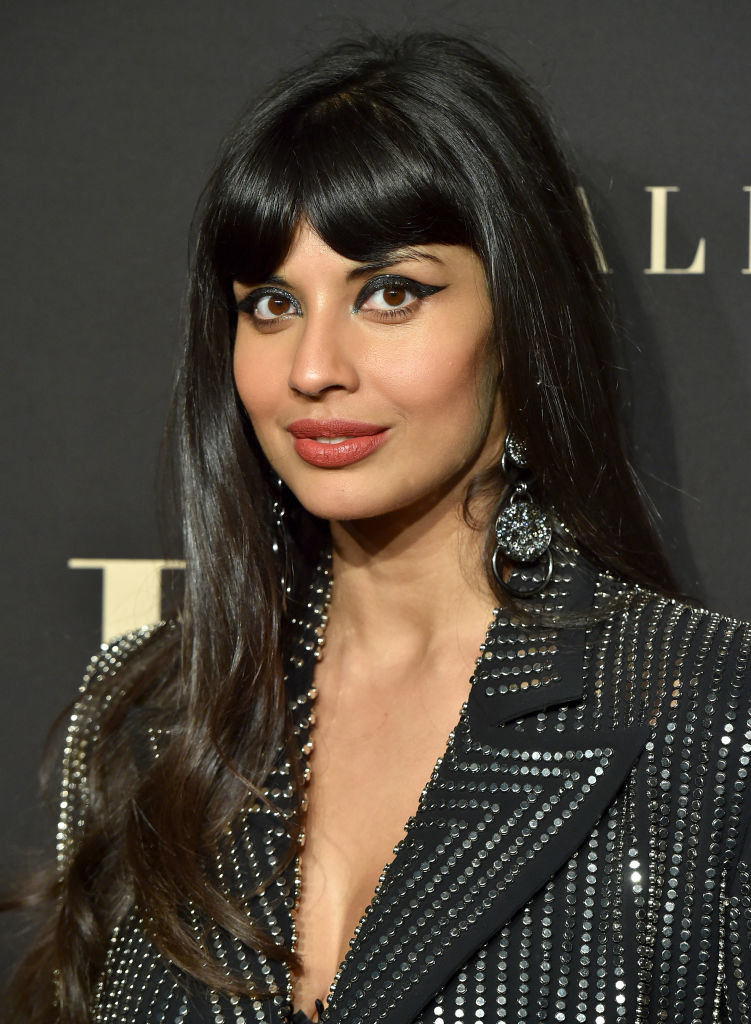 Dressed in a studded blazer with sharp, dramatic winged eyeliner, Jameela gives a small smile on the red carpet