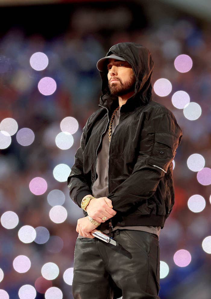 Eminem standing on stage during his Super Bowl performance