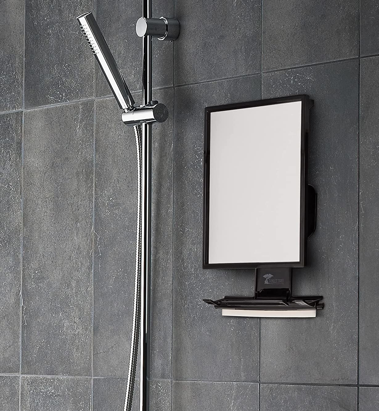 an adjustable anti fog mirror mounted on a tiled shower wall