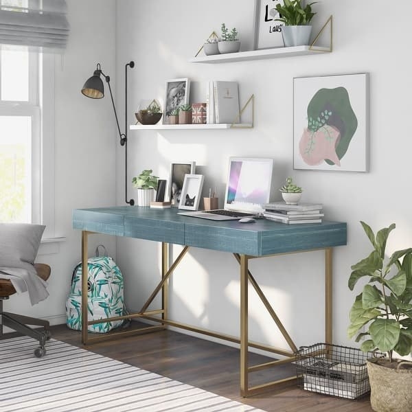 a blue writing desk with gold legs
