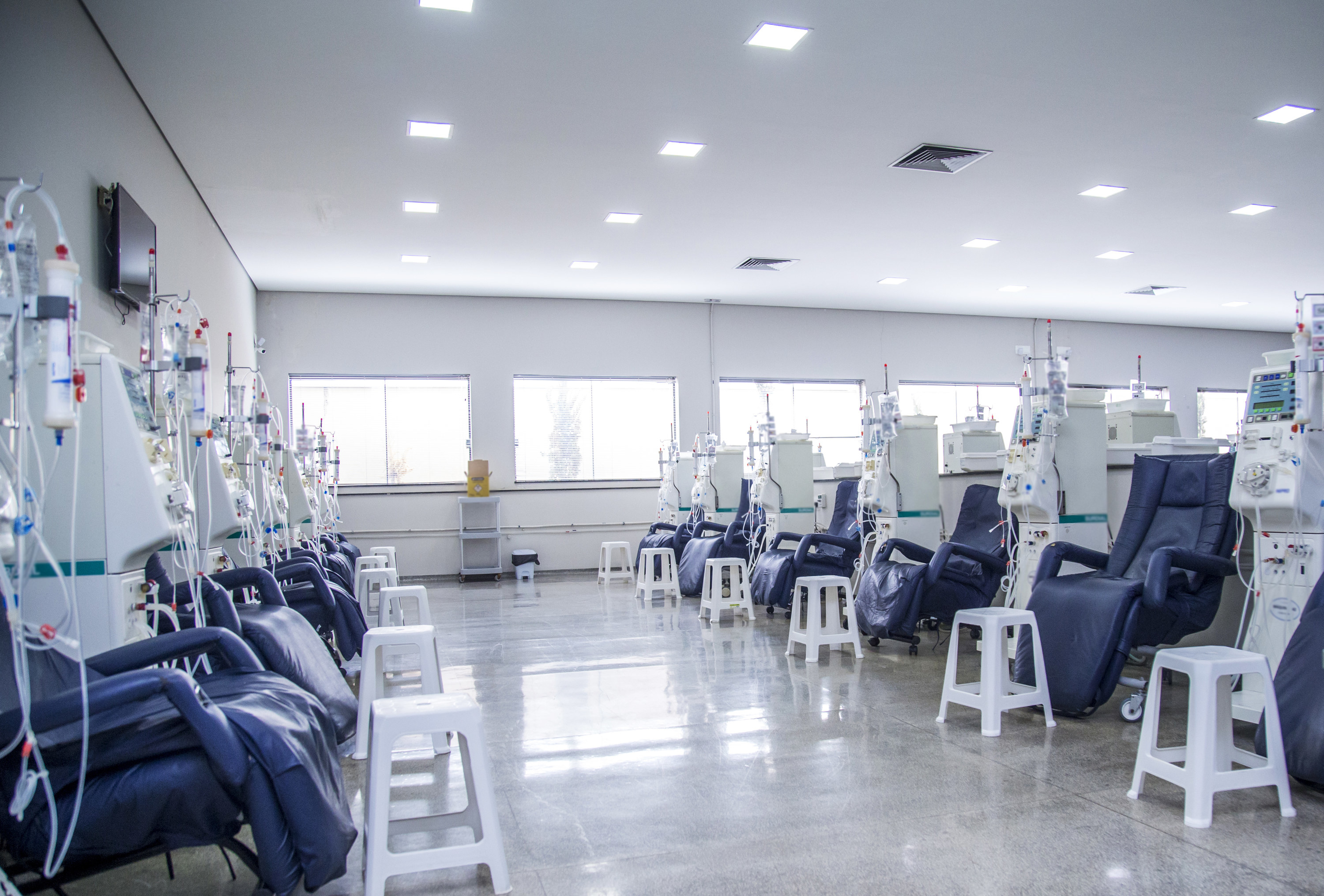 a room with chairs and dialysis machines