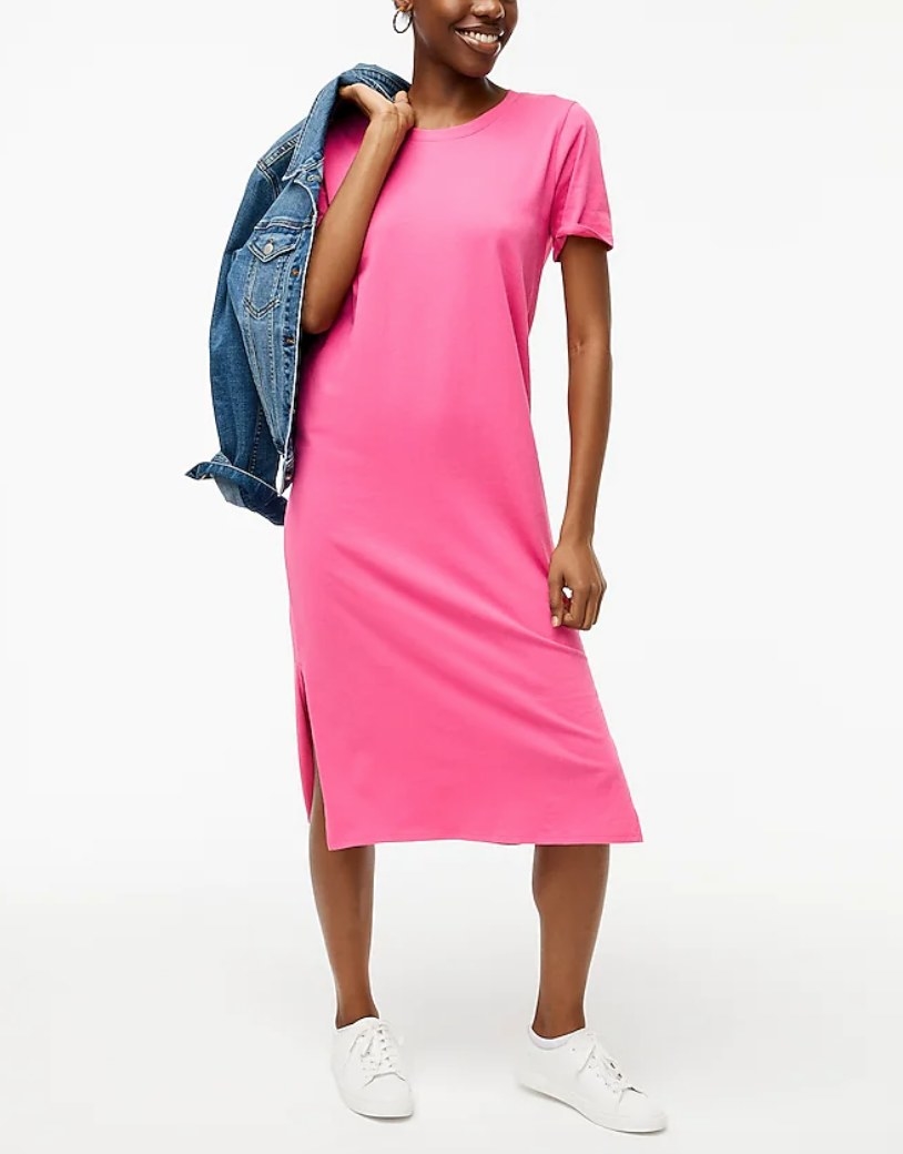 A model wearing a pink t-shirt dress