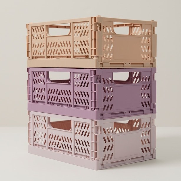 a trio of foldable storage crates stacked one on top of another