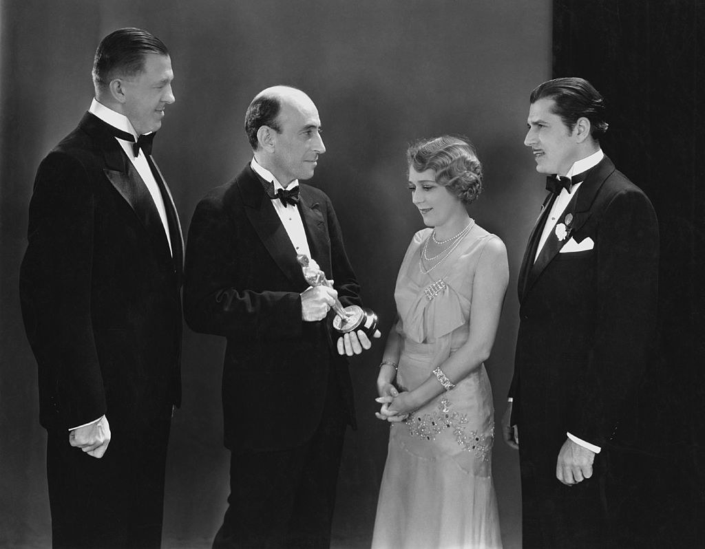 members of the Academy present Mary Pickford with her award