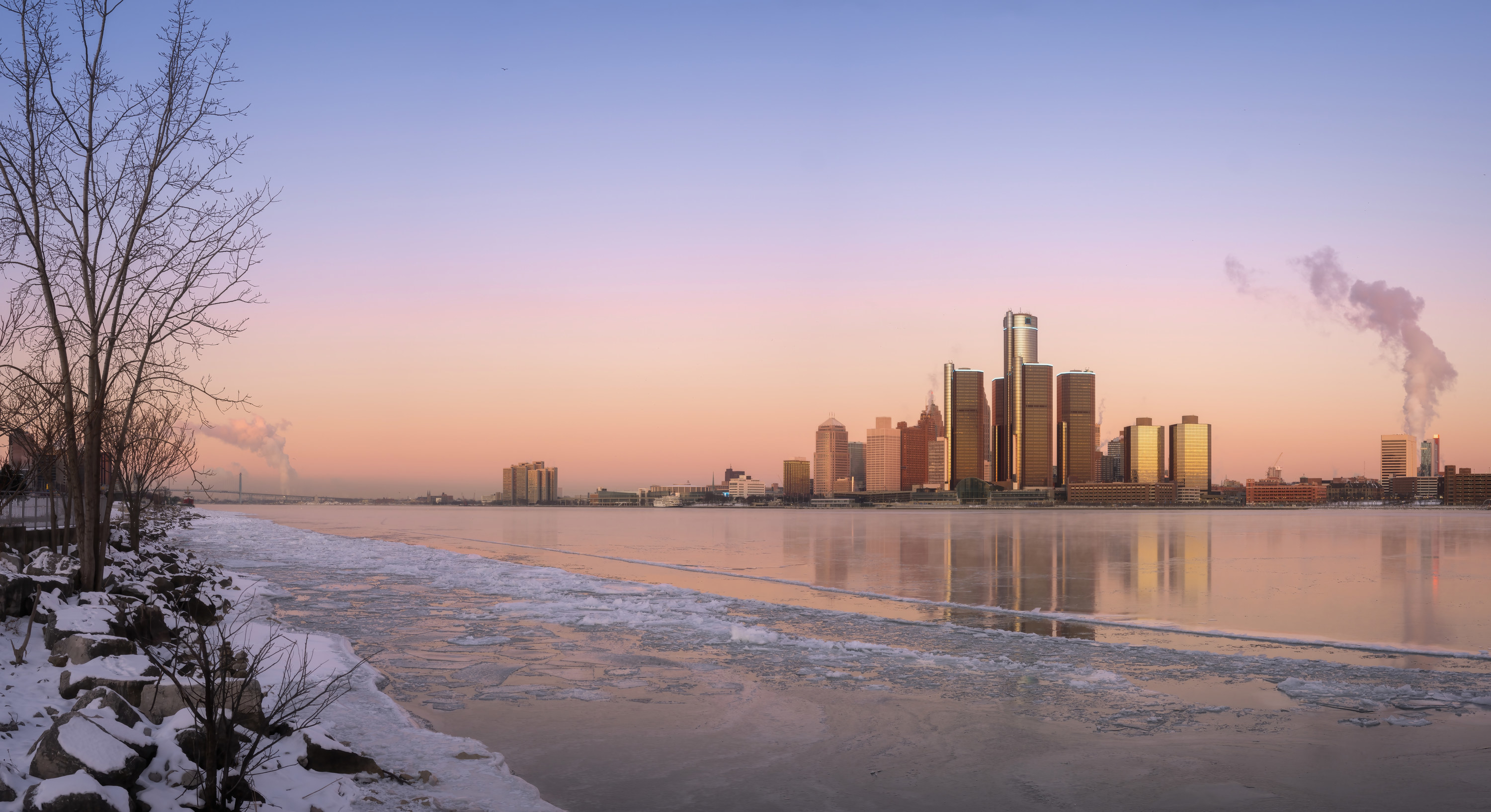The Detroit, MI skyline as seen from Windsor, Ontario at sunset