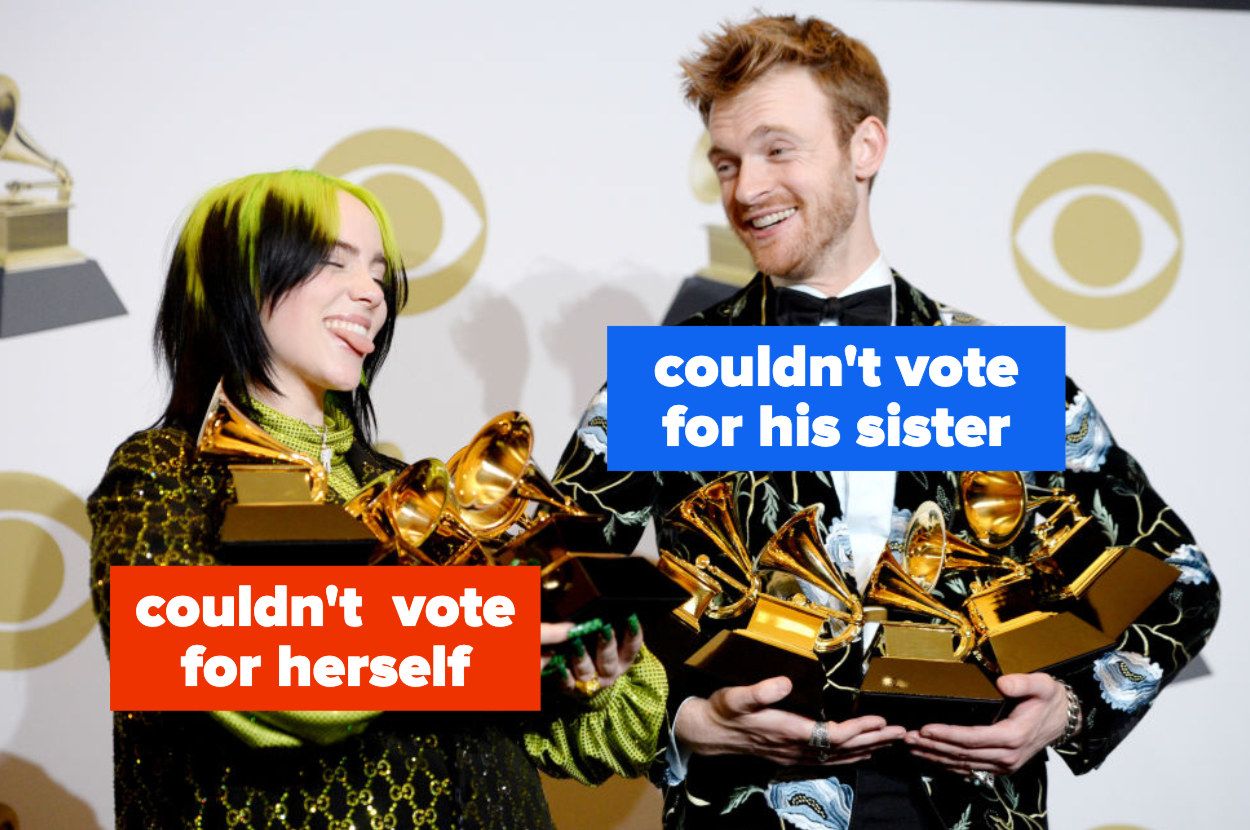Billie Eilish and Finneas hold their armloads of Grammys together