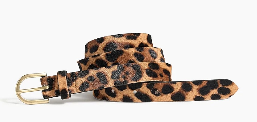 A leopard calf hair belt with a gold buckle