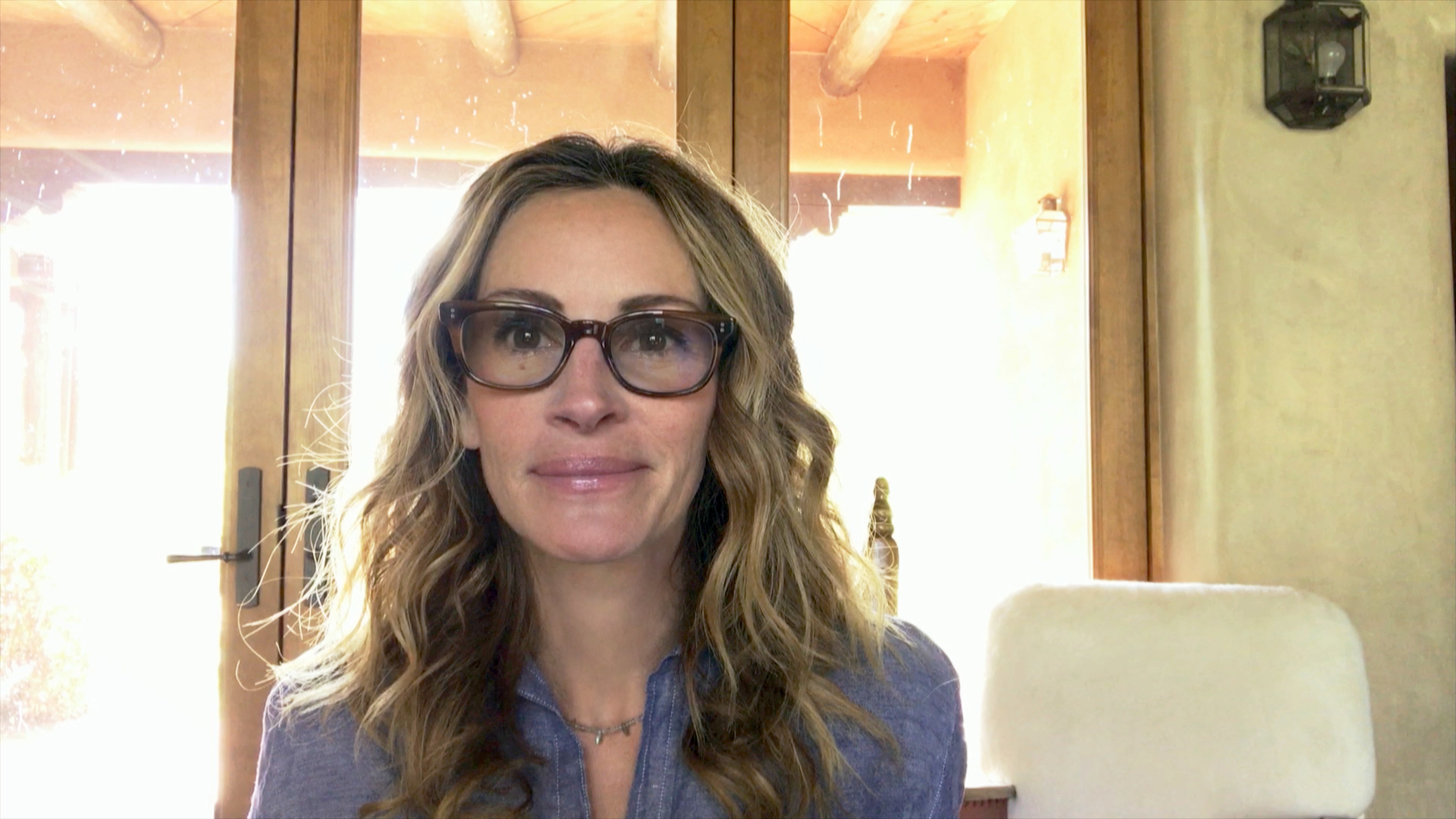 Julia Roberts sitting at her computer for a virtual interview