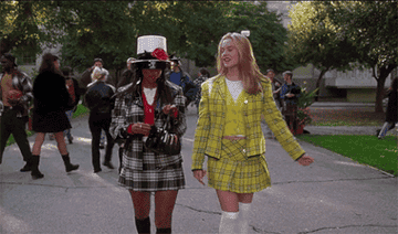 Cher and Dionne strut in their plaid outfits