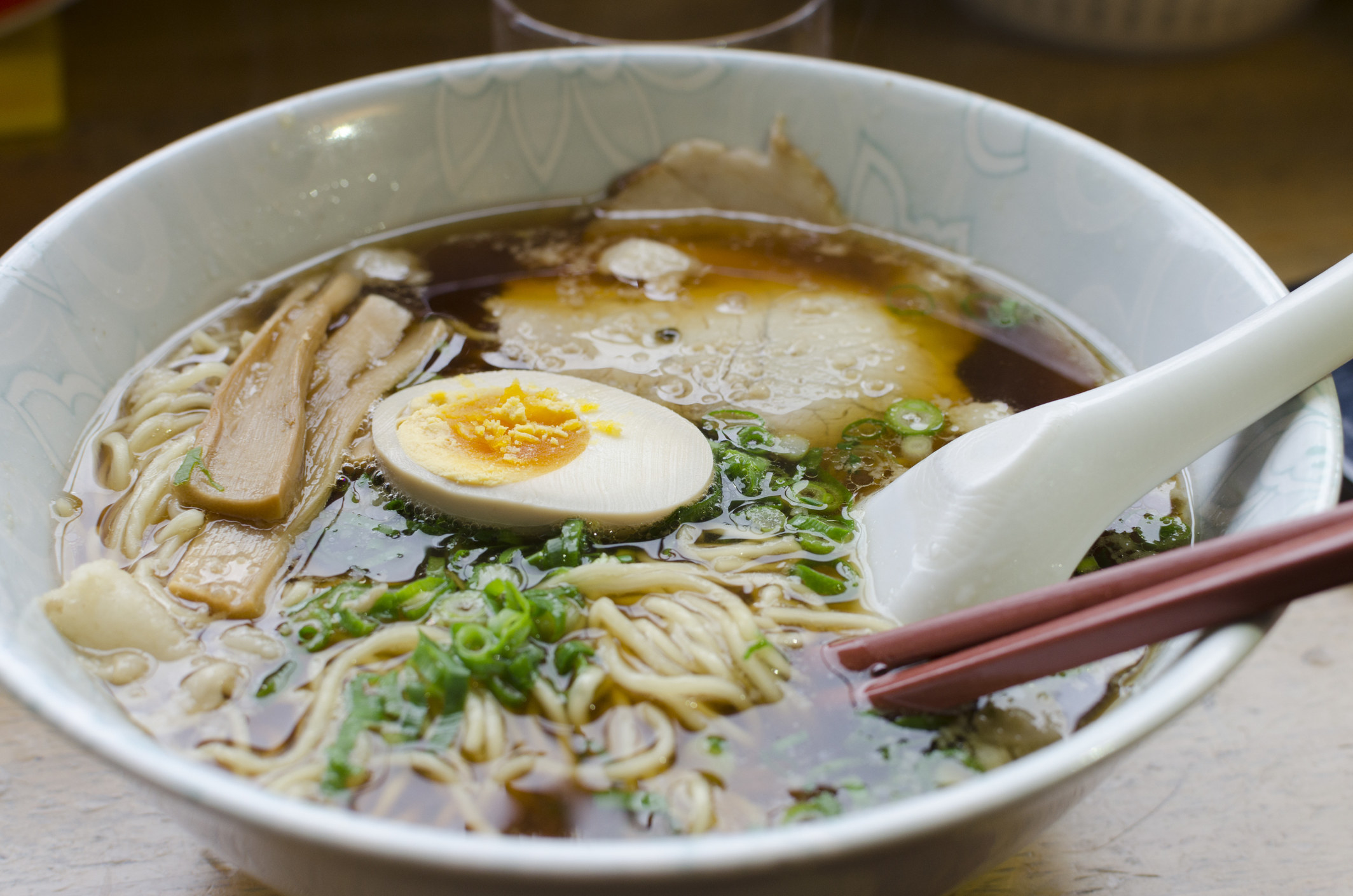 A bowl of ramen with soft boiled egg.