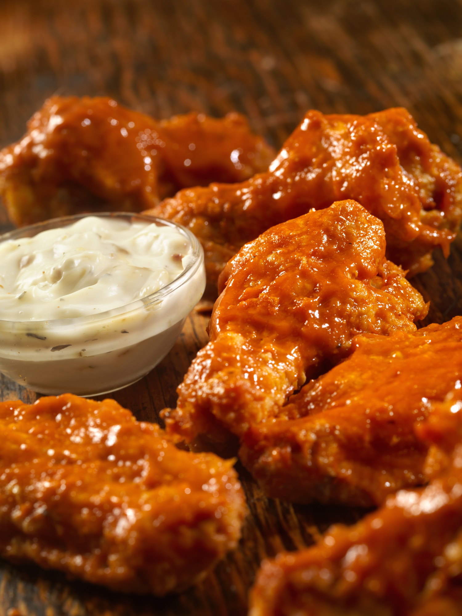 Hot buffalo chicken wings with dipping sauce.