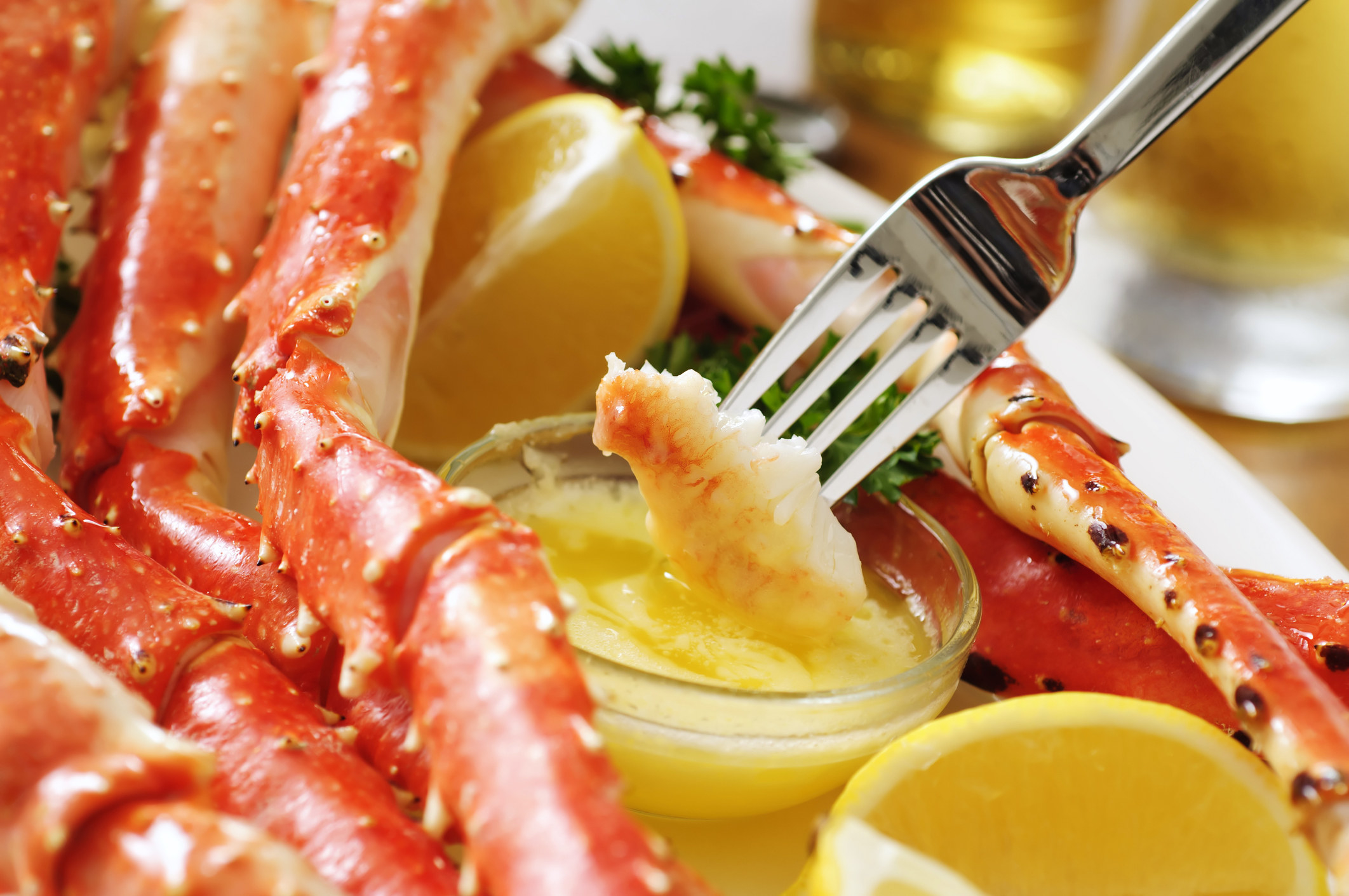 King crab legs with butter and lemon.