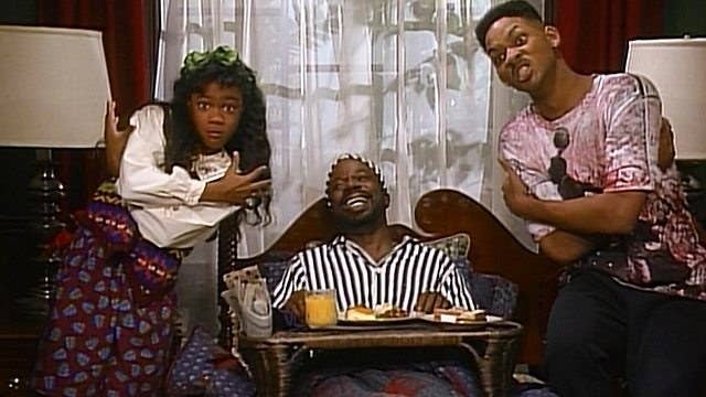 Ashley and Will stand with their arms crossed after performing a birthday rap for Geoffrey, who sits on his bed in the middle smiling on "The Fresh Prince Of Bel-Air"