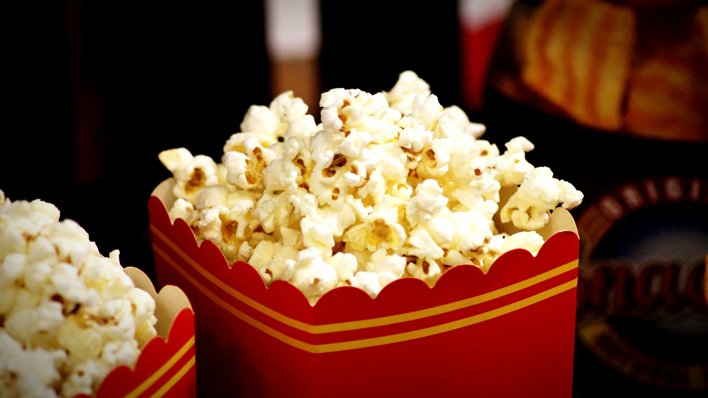 Two movie theater popcorns.