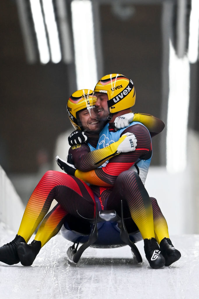 Two teammates hugging at the end of a race