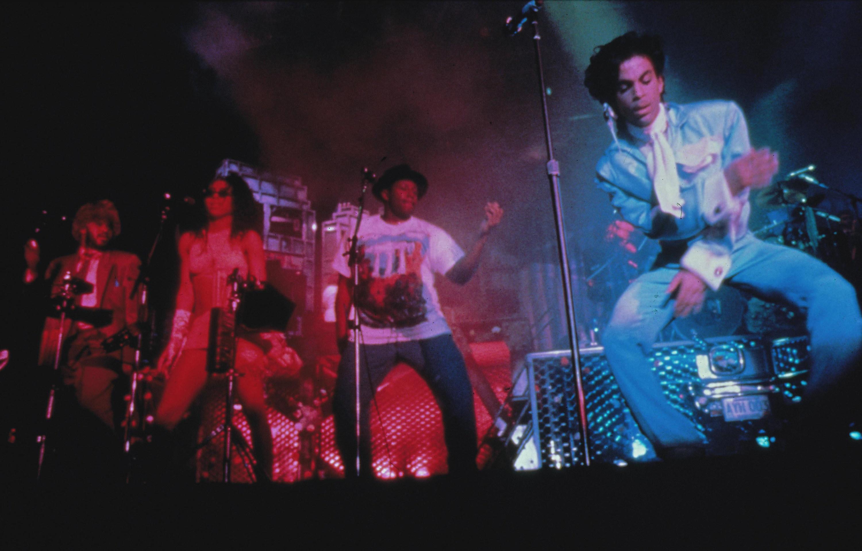 Prince performing with a band