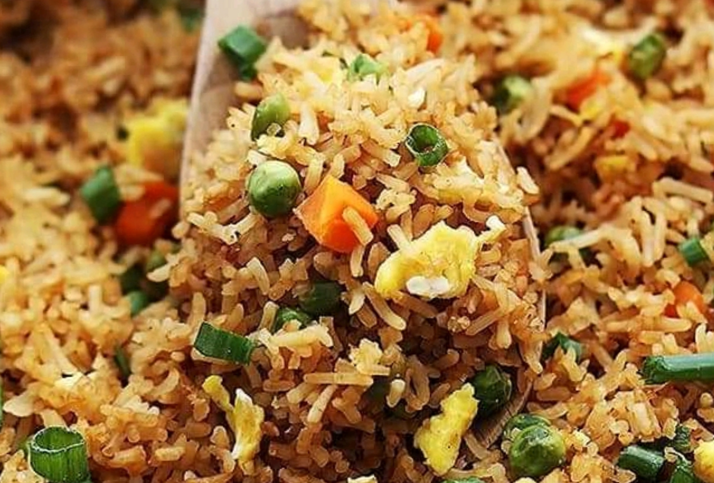 A big spoonful of vegetable fried rice
