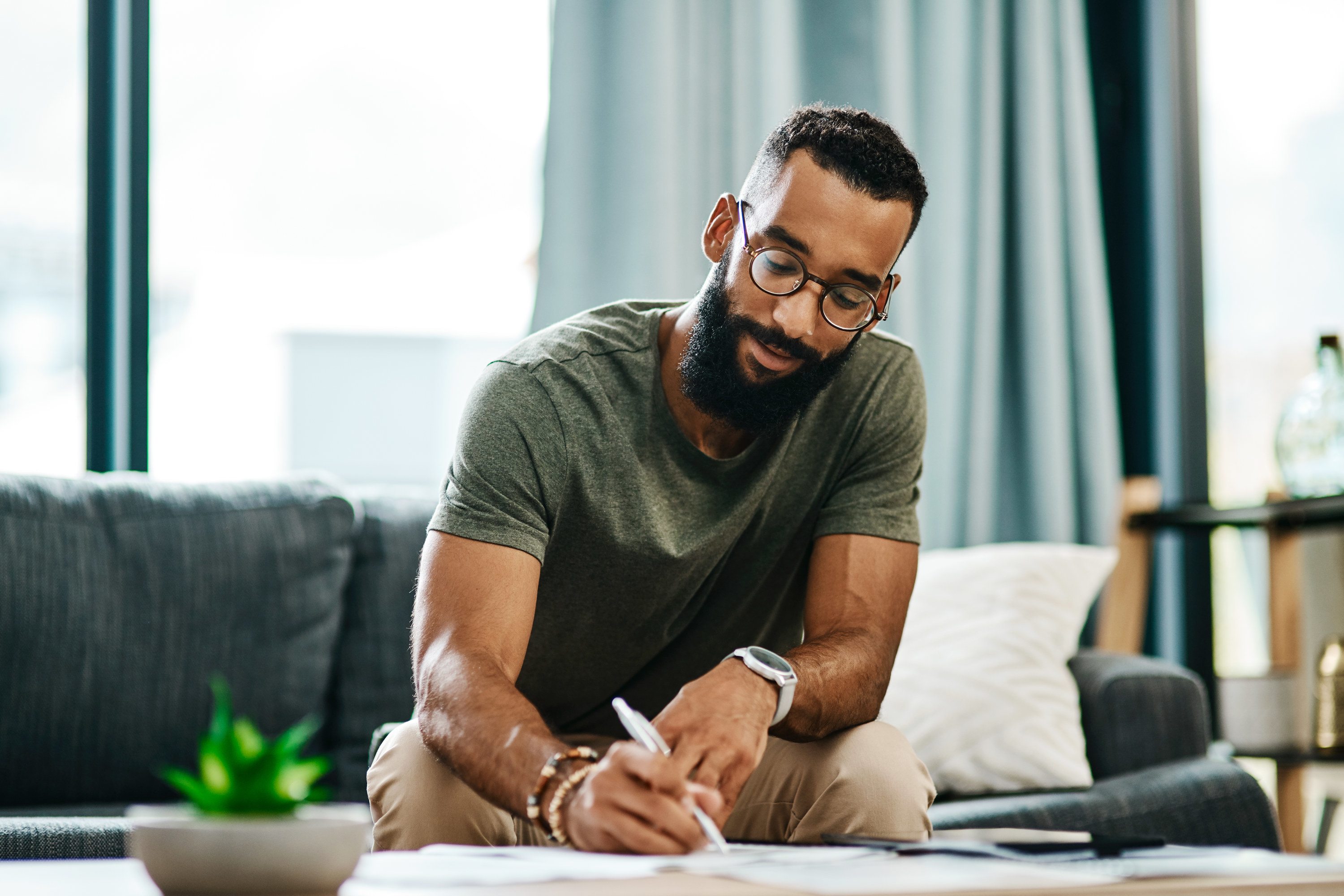 Man writing at a table