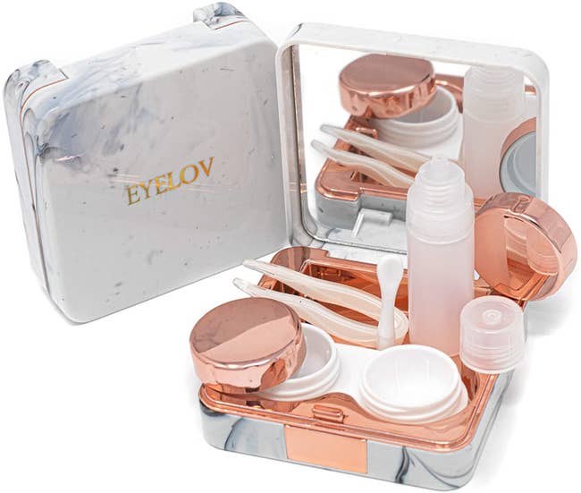 the white and grey marble case with rose gold contact lens case and three tools